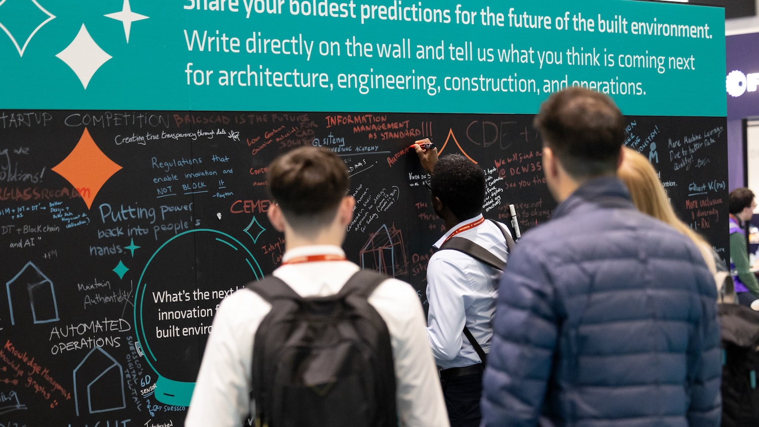 people writing on the Crystal Wall at DCW