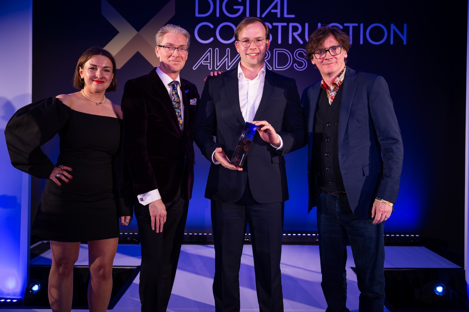 David Wisth of NavLive collects the trophy from Ed Byrne (far right), Justin Stanton of DC+ (second left) and Karolina Orecchini from Digital Construction Week (far left). Image: © 2026 - ASV Photography Ltd. www.ASVphotos.com