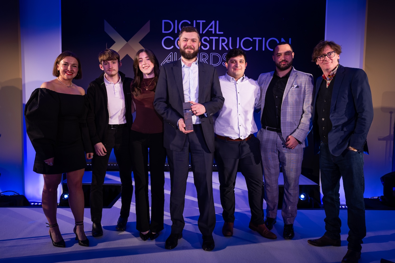 AtkinsRéalis collect their trophy from Ed Byrne (far right), Jordan Smith from Digital Construction North (second right) and Karolina Orecchini from Digital Construction Week (far left). Image: © 2026 - ASV Photography Ltd. www.ASVphotos.com