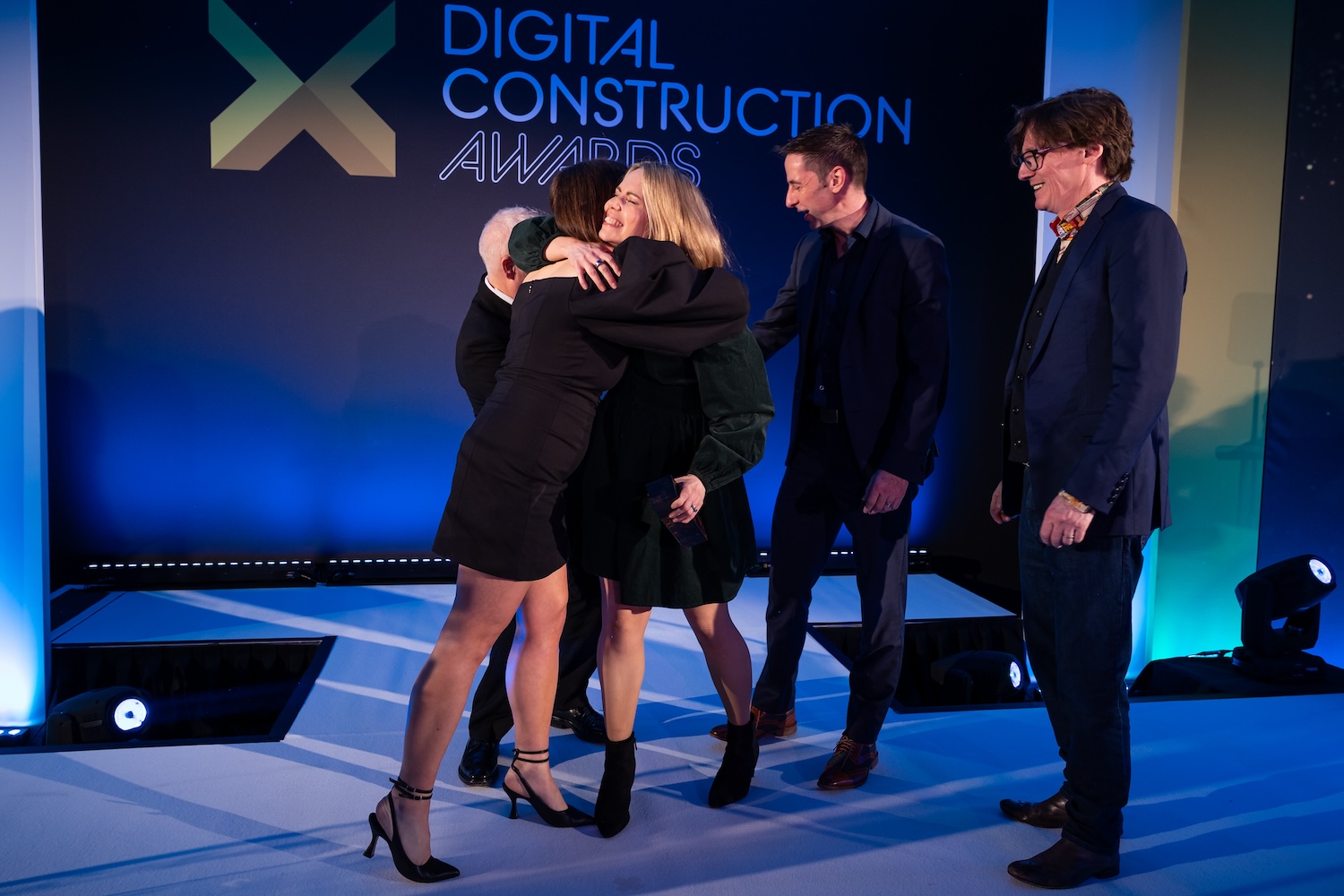 To the victor, the hugs, apparently... ONE Creative Environments on stage for the fourth trophy of the night. Image: © 2026 - ASV Photography Ltd. www.ASVphotos.com