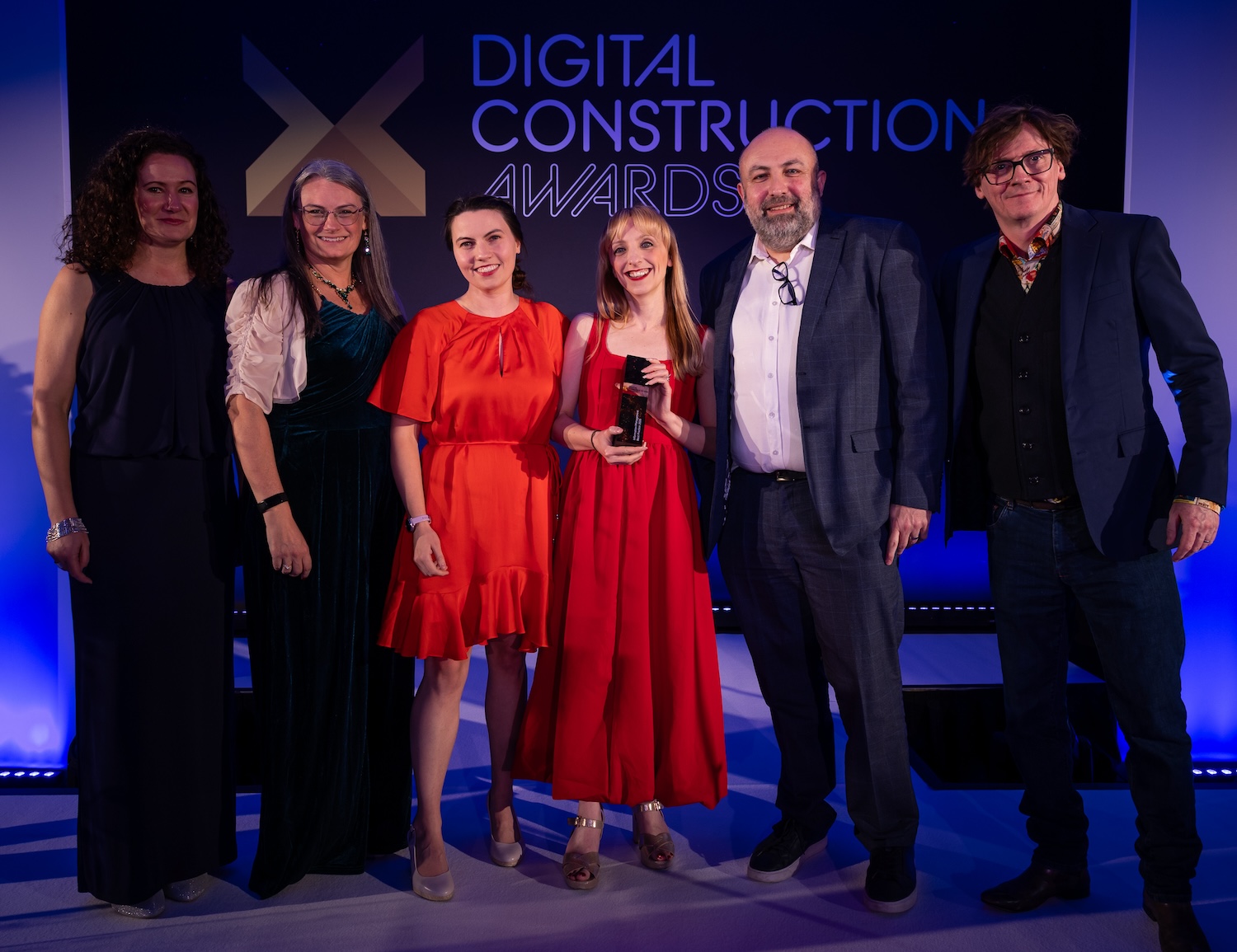 The RLB Digital team collect their trophy from Ed Byrne (far right) and Sarah Keyte of HKA (third left). Image: © 2026 - ASV Photography Ltd. www.ASVphotos.com