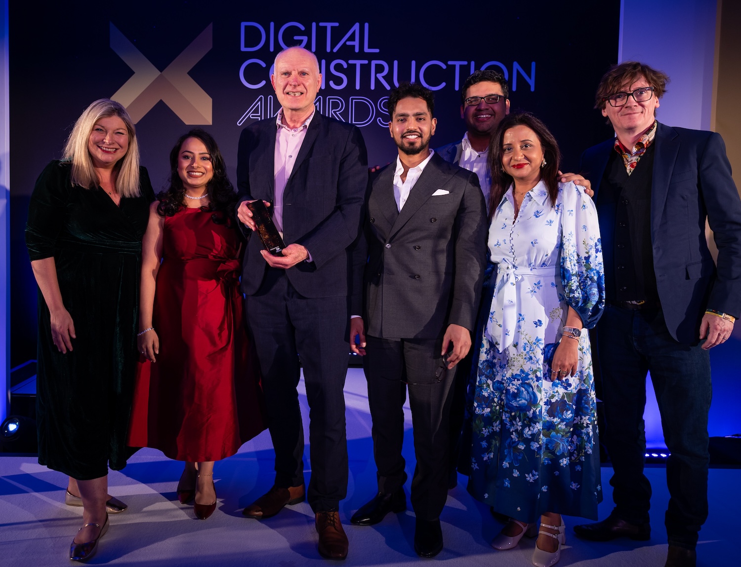 The Heathrow Airport team receive their trophy from Ed Byrne (far right) and Rachel Heaton of nima (far left). Image: © 2026 - ASV Photography Ltd. www.ASVphotos.com