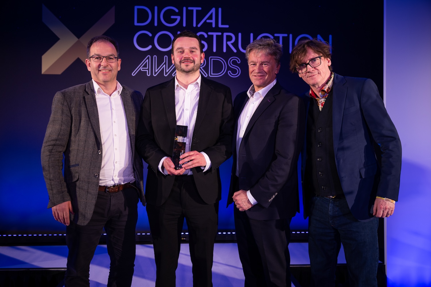 Cardiff Metropolitan University collect their trophy from Ed Byrne (far right) and Saul Humphrey of the CIOB (second right). Image: © 2026 - ASV Photography Ltd. www.ASVphotos.com
