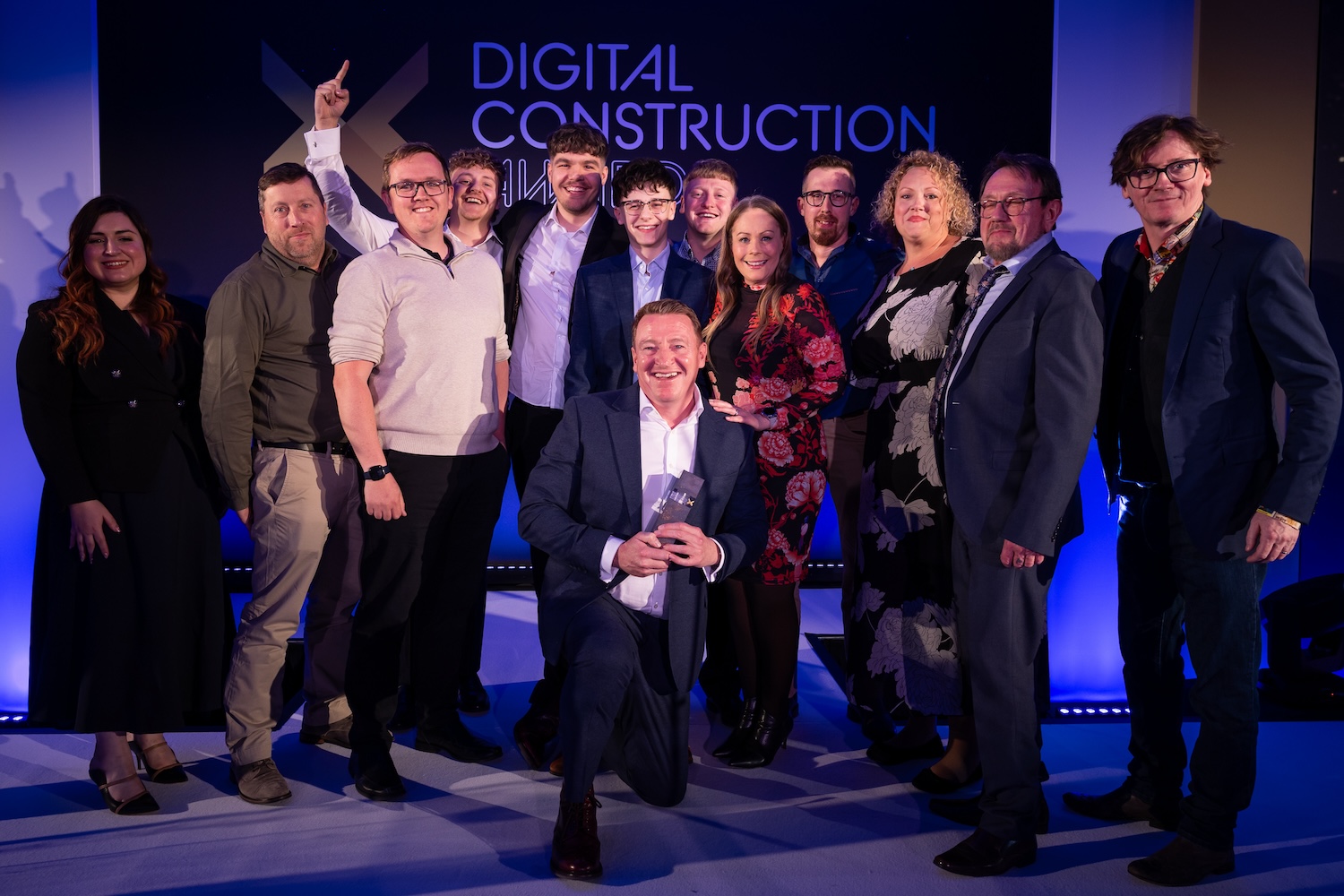 The Drone Surveying team collect their trophy from Ed Byrne (far right) and Hadeel Saadoon of the Connected Places Catapult. Image: © 2026 - ASV Photography Ltd. www.ASVphotos.com.