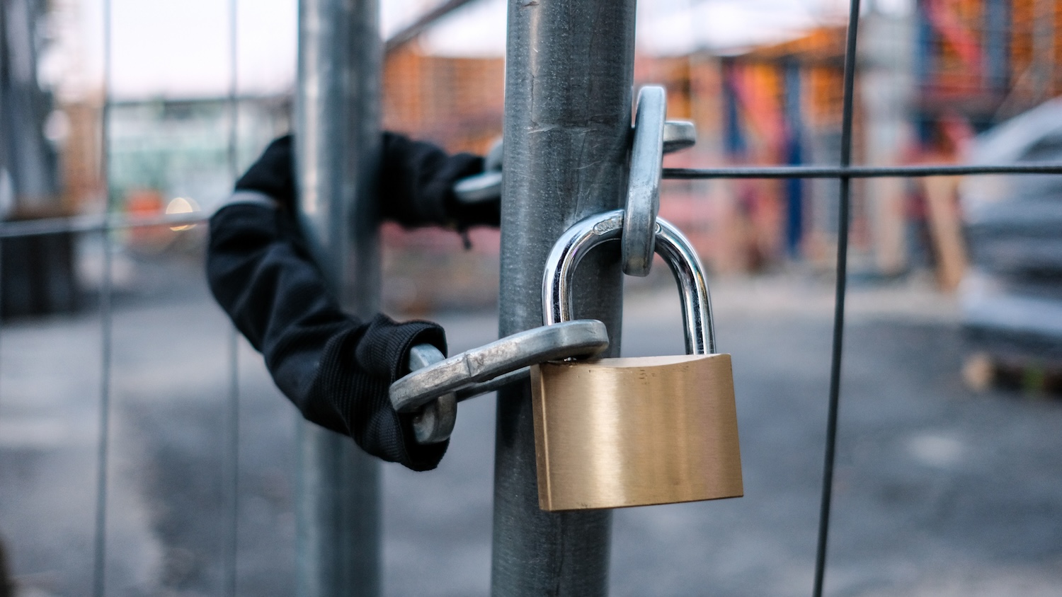 Padlocked construction site gate. Image: 95217957 © Hanohiki | Dreamstime.com